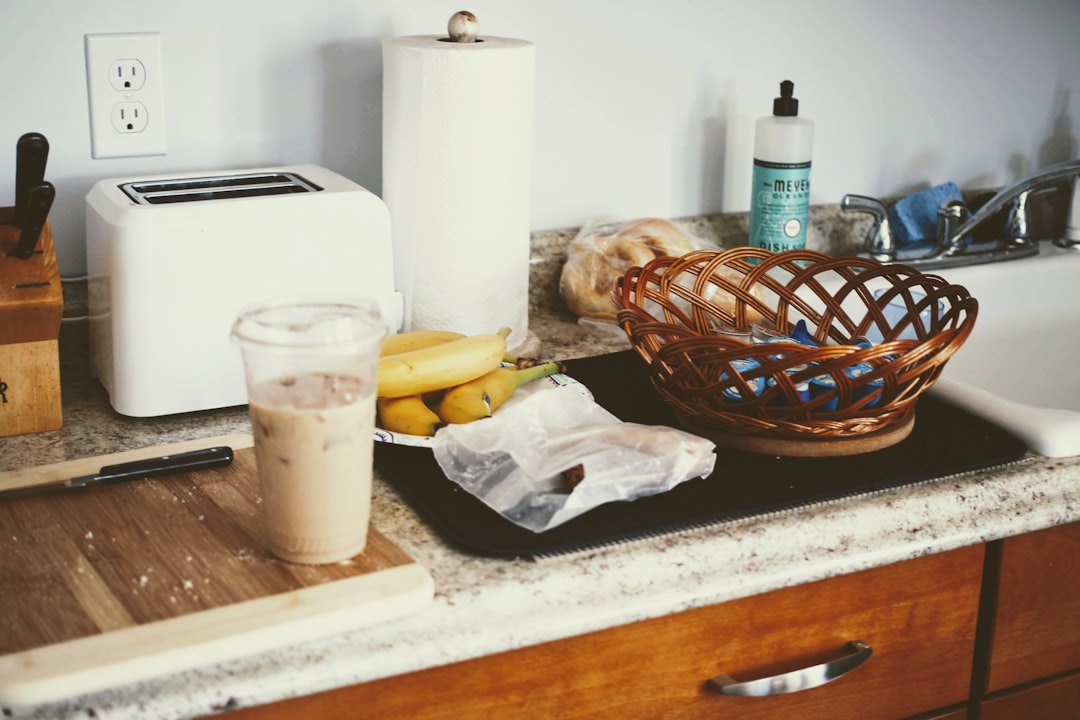 A bright and cozy kitchen in a holiday rental, with fresh bread and local ingredients on the counter, suggesting a home-like, authentic travel experience.